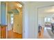 Hallway with wooden floors leading to multiple rooms at 7055 Old 421 Rd, Liberty, NC 27298