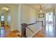 Hallway with wood floors, detailed trim, and views into other rooms at 7055 Old 421 Rd, Liberty, NC 27298