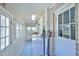 Bright laundry room with blue floors, white cabinets, and a brick accent wall at 7055 Old 421 Rd, Liberty, NC 27298