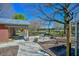 Brick patio with a covered seating area, outdoor dining table and view of the property at 7055 Old 421 Rd, Liberty, NC 27298