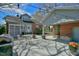 Expansive patio area perfect for entertaining, with an outdoor kitchen and views of the charming brick home at 7055 Old 421 Rd, Liberty, NC 27298
