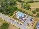Overhead shot of the community pool showcasing the parking lot, landscaping, and the nearby road at 706 Tibumoll Ln, Fuquay Varina, NC 27526