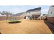 Wide view of a home's spacious backyard, complete with trampoline and privacy fence at 706 Tibumoll Ln, Fuquay Varina, NC 27526