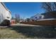 Fenced backyard with a mix of greenery and ample open space at 712 Ledgerock Rd, Wake Forest, NC 27587
