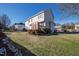 Well-maintained backyard with lush greenery and home exterior view at 712 Ledgerock Rd, Wake Forest, NC 27587