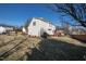 Expansive backyard with a manicured lawn and attractive home facade at 712 Ledgerock Rd, Wake Forest, NC 27587