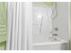 Clean and bright bathroom featuring a white shower and decorative shower curtain at 712 Ledgerock Rd, Wake Forest, NC 27587