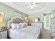 Bright bedroom boasting a decorative ceiling and an upholstered headboard with decorative pillows at 712 Ledgerock Rd, Wake Forest, NC 27587
