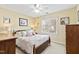 Bedroom featuring a ceiling fan, a window, and furnishings that complement the beige walls at 712 Ledgerock Rd, Wake Forest, NC 27587