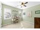 Bright room with neutral walls and carpet, with two windows letting in natural light at 712 Ledgerock Rd, Wake Forest, NC 27587