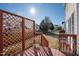 Red deck with lattice and metal decor featuring a lush backyard view at 712 Ledgerock Rd, Wake Forest, NC 27587