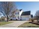 Charming two-story home with a well-maintained lawn and attached two-car garage at 712 Ledgerock Rd, Wake Forest, NC 27587