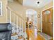 Warm and welcoming foyer with hardwood floors and a view into the dining area at 712 Ledgerock Rd, Wake Forest, NC 27587