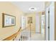 Bright hallway with carpeted floor, offering access to several rooms at 712 Ledgerock Rd, Wake Forest, NC 27587