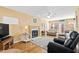 Inviting living room with hardwood floors, fireplace, and comfortable seating area at 712 Ledgerock Rd, Wake Forest, NC 27587