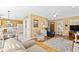 Open-concept living area featuring hardwood floors, a dining area, and access to the kitchen at 712 Ledgerock Rd, Wake Forest, NC 27587