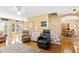 Spacious living room with hardwood floors, cozy seating, and bright natural light at 712 Ledgerock Rd, Wake Forest, NC 27587