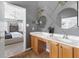 Bathroom featuring double sink vanity, modern lighting, and decorative wall trim at 804 Chancellors Ridge Dr, Durham, NC 27713