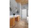 Bright bathroom featuring double vanities, unique geometric wall decor, and modern fixtures at 804 Chancellors Ridge Dr, Durham, NC 27713