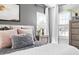 Tastefully decorated bedroom featuring neutral tones, a plush bed, and abundant natural light at 804 Chancellors Ridge Dr, Durham, NC 27713