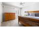 Comfortable bedroom with a wooden bed frame, dresser, and bright natural light at 804 Chancellors Ridge Dr, Durham, NC 27713