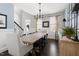 Elegant dining room with a large wooden table, stylish chairs, and modern lighting at 804 Chancellors Ridge Dr, Durham, NC 27713