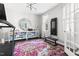 Bright exercise room with a treadmill, weight machine, and storage shelves at 804 Chancellors Ridge Dr, Durham, NC 27713