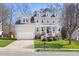 Charming two-story home with a manicured lawn and welcoming front porch at 804 Chancellors Ridge Dr, Durham, NC 27713