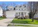Charming two-story home with a manicured lawn and welcoming front porch at 804 Chancellors Ridge Dr, Durham, NC 27713