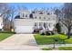 Charming two-story home with a manicured lawn and welcoming front porch at 804 Chancellors Ridge Dr, Durham, NC 27713