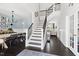 Spacious foyer with a staircase, dark wood floors, and views of the dining and living areas at 804 Chancellors Ridge Dr, Durham, NC 27713