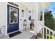 Close-up of the front door with a wreath, stylish decor, and sidelight window at 804 Chancellors Ridge Dr, Durham, NC 27713