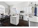 Open-concept kitchen boasts a large island, white cabinets, and pendant lighting at 804 Chancellors Ridge Dr, Durham, NC 27713