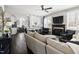 Open-concept living room featuring a fireplace, dark wood floors, and modern decor at 804 Chancellors Ridge Dr, Durham, NC 27713