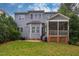 Spacious backyard with a screened porch, patio, and lush green lawn perfect for outdoor enjoyment at 812 Long Meadows Rd, Chapel Hill, NC 27516