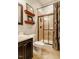Functional bathroom with shower, toilet, vanity and decorative shelves at 812 Long Meadows Rd, Chapel Hill, NC 27516