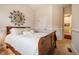 Comfortable bedroom with queen bed, carpeted floors, and decorative mirror at 812 Long Meadows Rd, Chapel Hill, NC 27516