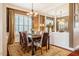 Formal dining room featuring hardwood floors, a chandelier and a large mirror at 812 Long Meadows Rd, Chapel Hill, NC 27516