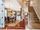 Elegant dining room with hardwood floors, a chandelier and a staircase to the upper level at 812 Long Meadows Rd, Chapel Hill, NC 27516