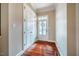 Spacious foyer with hardwood floors, a closet and a door featuring glass panels at 812 Long Meadows Rd, Chapel Hill, NC 27516