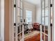 Stylish home office with French doors, hardwood floors and a comfortable workspace at 812 Long Meadows Rd, Chapel Hill, NC 27516