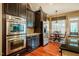 Well-equipped kitchen with stainless steel appliances and a cozy breakfast nook at 812 Long Meadows Rd, Chapel Hill, NC 27516