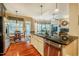 Open kitchen with a large island, stainless appliances, and seamless flow to other spaces at 812 Long Meadows Rd, Chapel Hill, NC 27516