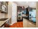 Modern kitchen with stainless appliances, granite countertops, and tile backsplash at 812 Long Meadows Rd, Chapel Hill, NC 27516