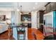 Modern kitchen with dark cabinets, stainless steel appliances, and granite countertops at 812 Long Meadows Rd, Chapel Hill, NC 27516