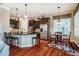 Stylish kitchen with stainless steel appliances, dark cabinetry, and granite countertops at 812 Long Meadows Rd, Chapel Hill, NC 27516