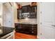 Stylish kitchen featuring dark cabinetry, granite counters and stainless appliances at 812 Long Meadows Rd, Chapel Hill, NC 27516