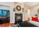 Cozy living room with a fireplace, large TV, and comfortable seating at 812 Long Meadows Rd, Chapel Hill, NC 27516