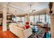 Open-concept living room with hardwood floors and bright windows, perfect for entertaining at 812 Long Meadows Rd, Chapel Hill, NC 27516