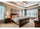 Beautiful main bedroom boasts natural light, king bed, and a view of the yard at 812 Long Meadows Rd, Chapel Hill, NC 27516